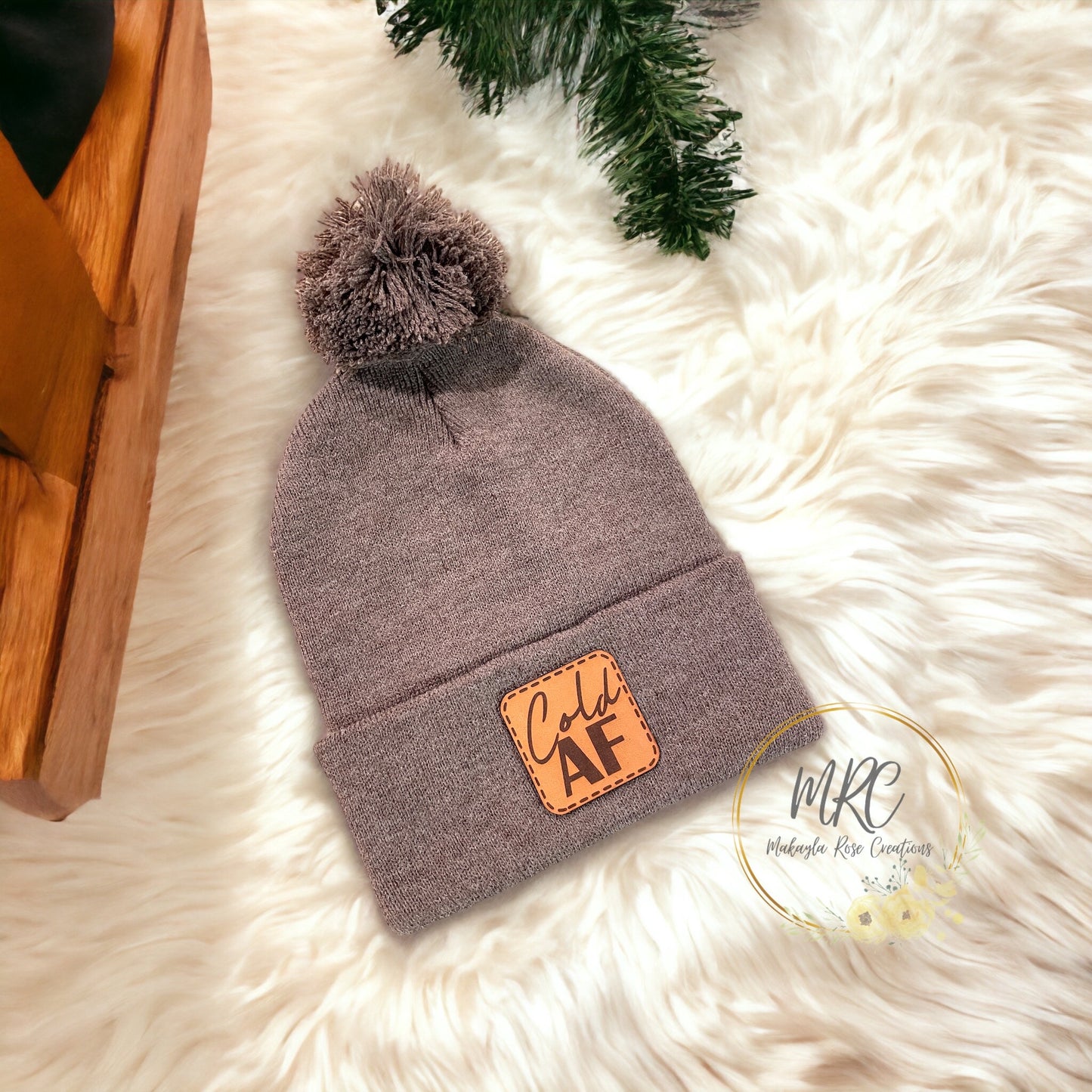 “Cold AF” PomPom Cuffed Winter Hat w/ Leather Patch